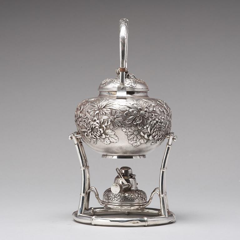 A Japanese silver tea pot with burner and stand, makers mark Samurai Shokai, Yokohama, Sterling.