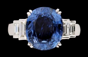 615. A white gold and blue sapphire ring.