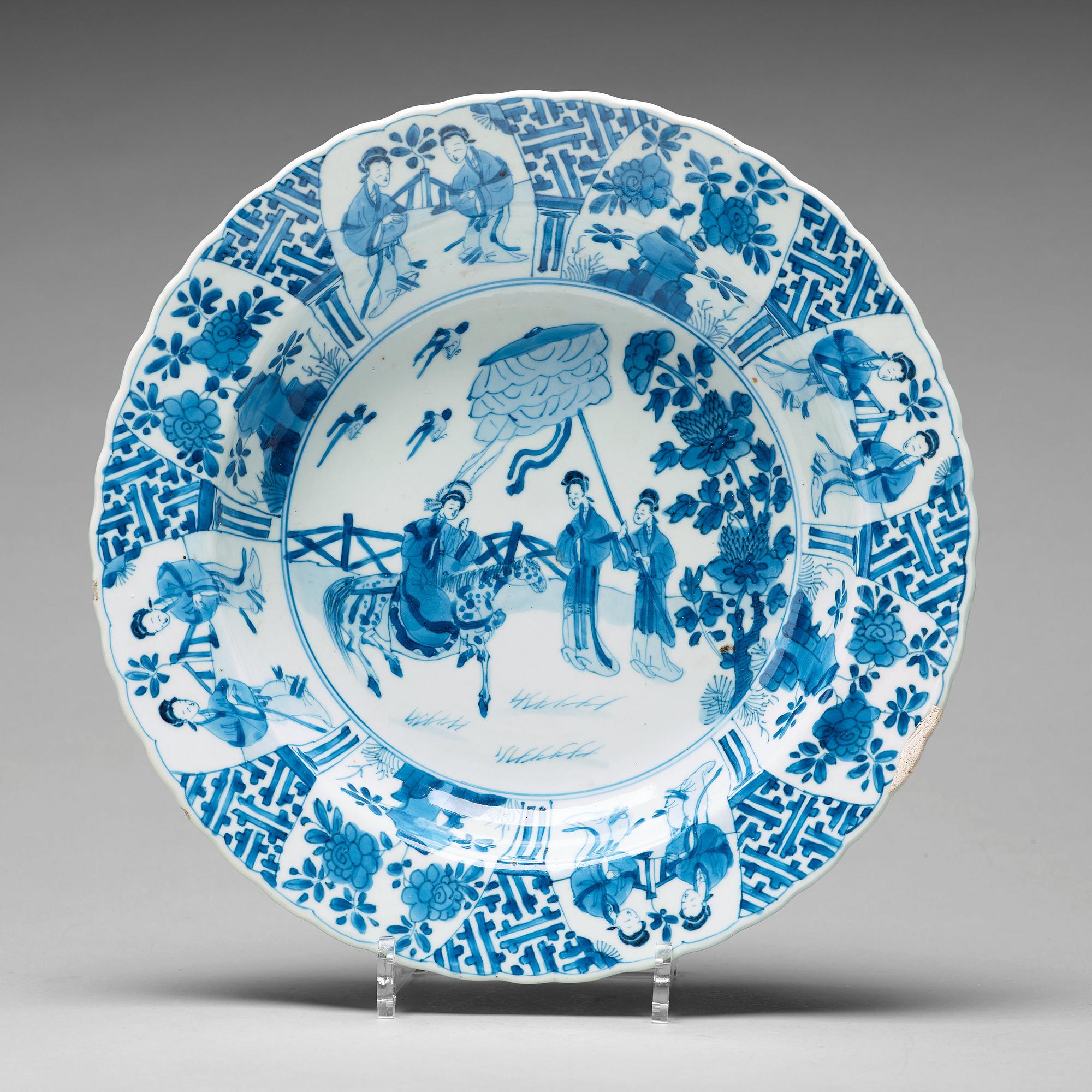 A large blue and white deep dish, Qing dynasty, with Kangxi six character mark and period (1662-1722).