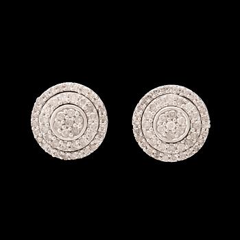 A pair of 14K white gold earrings set with round single-cut diamonds.
