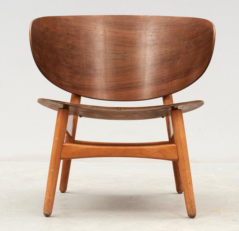 A Hans J Wegner mahogany and beech easy chair, Denmark 1950's.