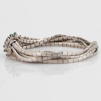 Armband 18K vitguld med fasettslipade smaragder.
