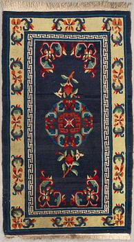 A Tibetan old/semi-antique rug, c. 167 x 95 cm.