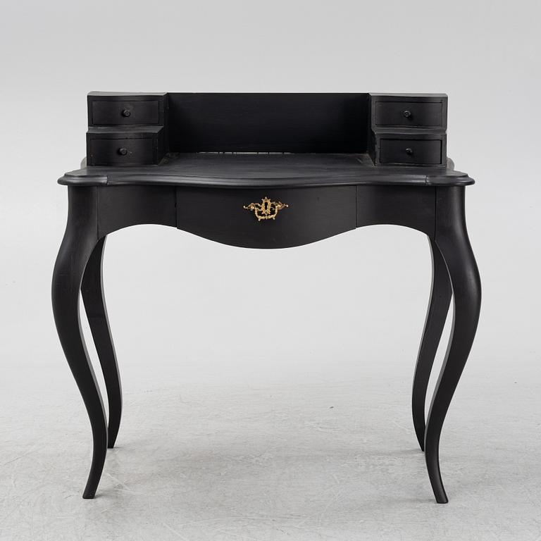 A painted rococo style writing desk, from around the year 1900.