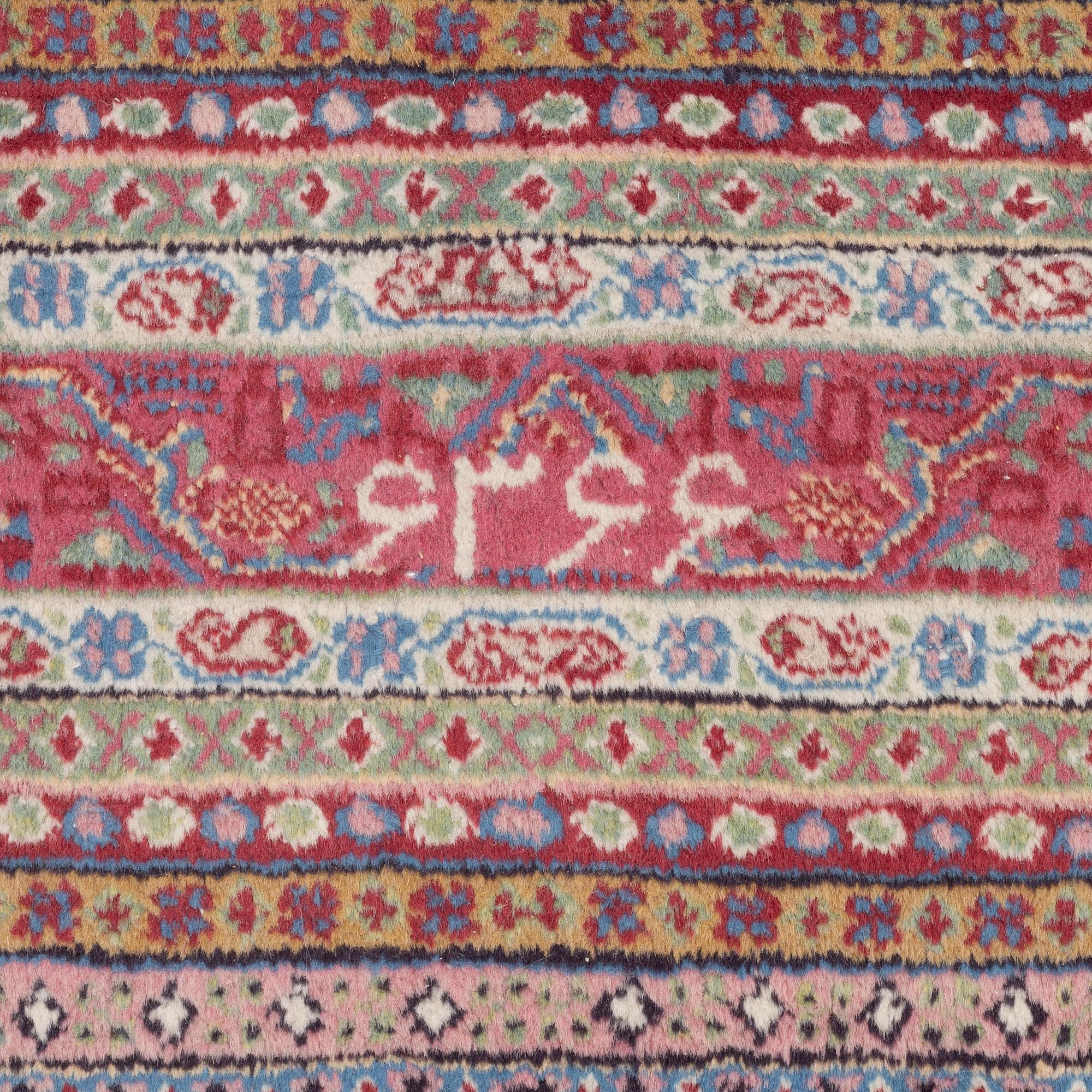 A oriental carpet, signed, c. 295 x 295 cm.