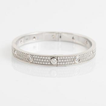 A Cartier "Love Pavé" in 18K white gold set with round brilliant-cut diamonds.