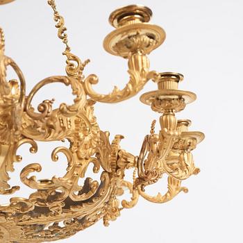 A rococo-revival gilt-brass sixteen-light chandelier, mid 19th century.