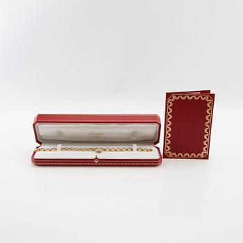 Cartier, Armband av 18K guld med runda briljantslipade diamanter.