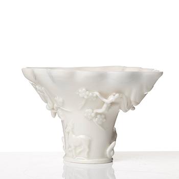 A blanc de chine rhinoserous libation cup, Qing dynasty, Kangxi (1662-1722).