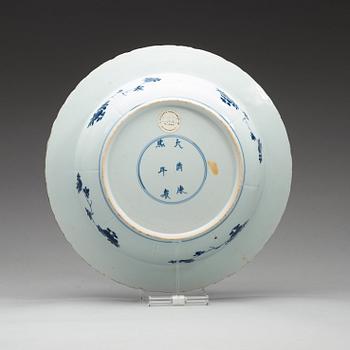 A blue and white dish, Qing dynasty, with Kangxis six character mark and period (1662-1722).