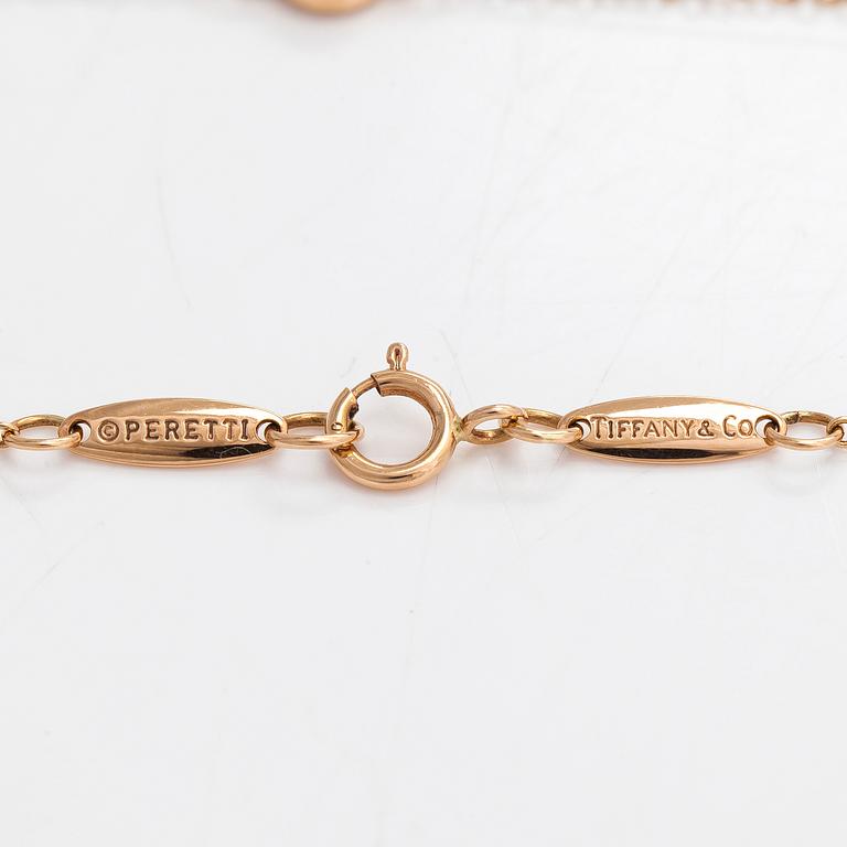 Tiffany & Co, Elsa Peretti, an 18K gold bracelet with a brilliant cut diamond ca 0.07 ct.