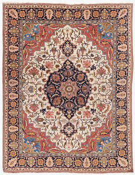 An antique Tabriz carpet, c. 365 x 280 cm.