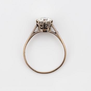 A round brilliant-cut diamond ring.