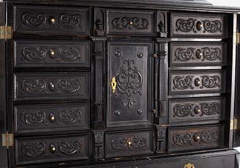 A South-German Baroque ebonized collector's cabinet on stand, circa 1700.