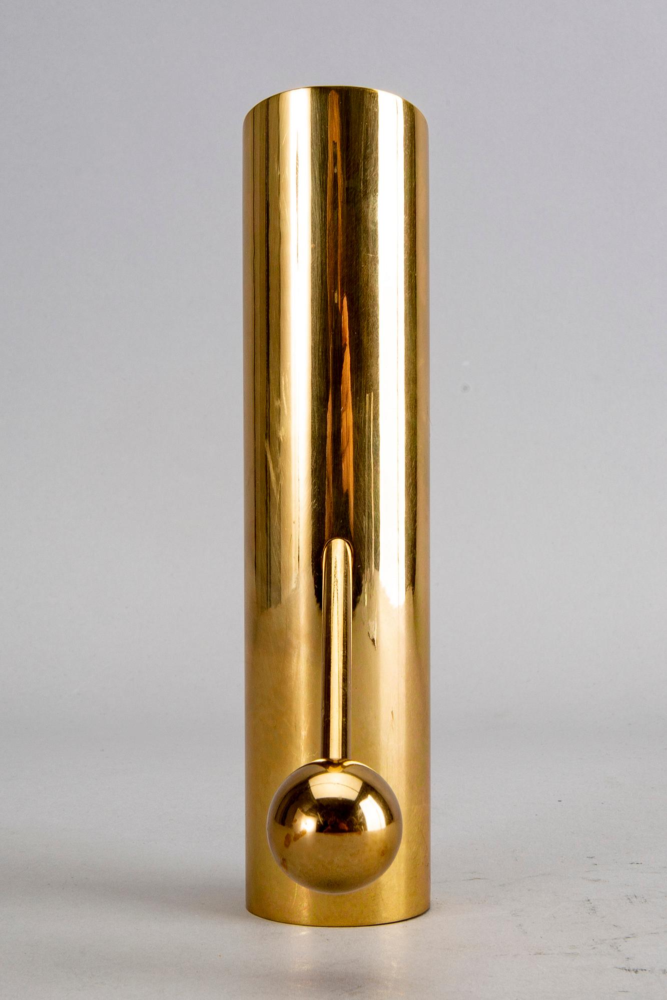 A Pierre Forssell brass candle stick for Skultuna.
