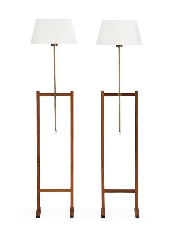 A pair of Josef Frank walnut floor lamps, Svenskt Tenn, model 2548.