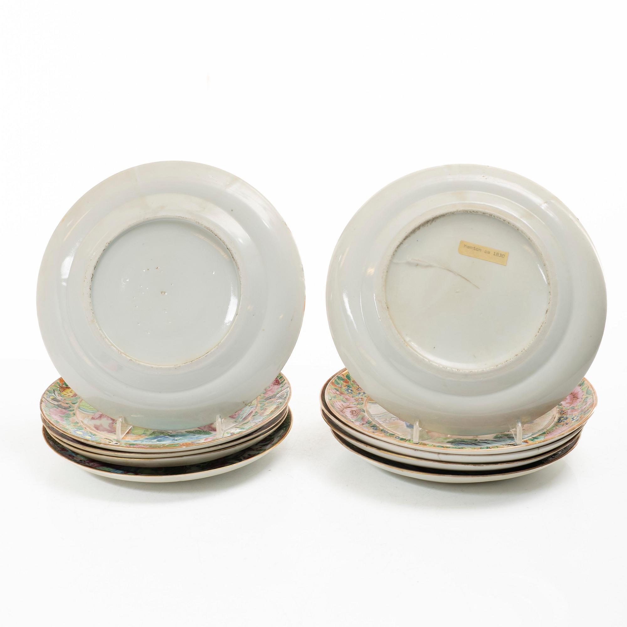 A matched set of 14 famille rose 'Canton' dinner plates, Qing dynasty, 19th century.