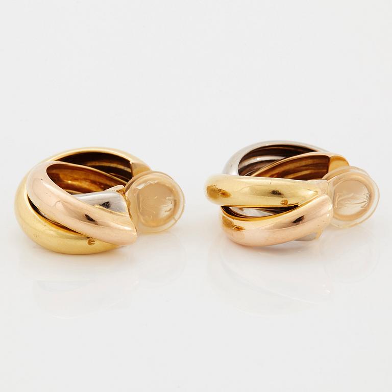 A pair of Cartier "Trinity" earrings in 18K gold.
