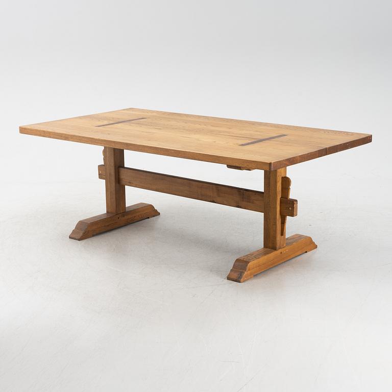 An oak trestle table.
