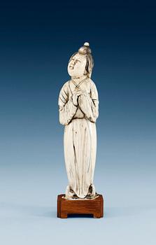 1297. A Tang style ivory figure of a court lady, presumably late Ming dynasty (1368-1644).