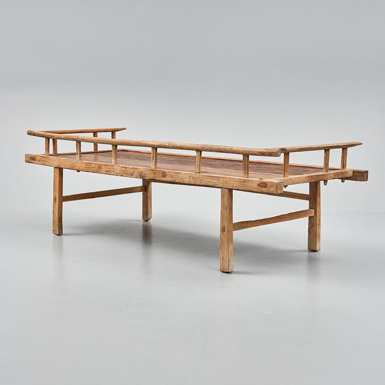 A wooden daybed, South East Asia.