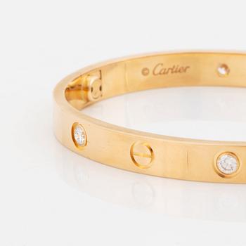 A Cartier bracelet "Love" in 18K gold set with round brilliant-cut diamonds.