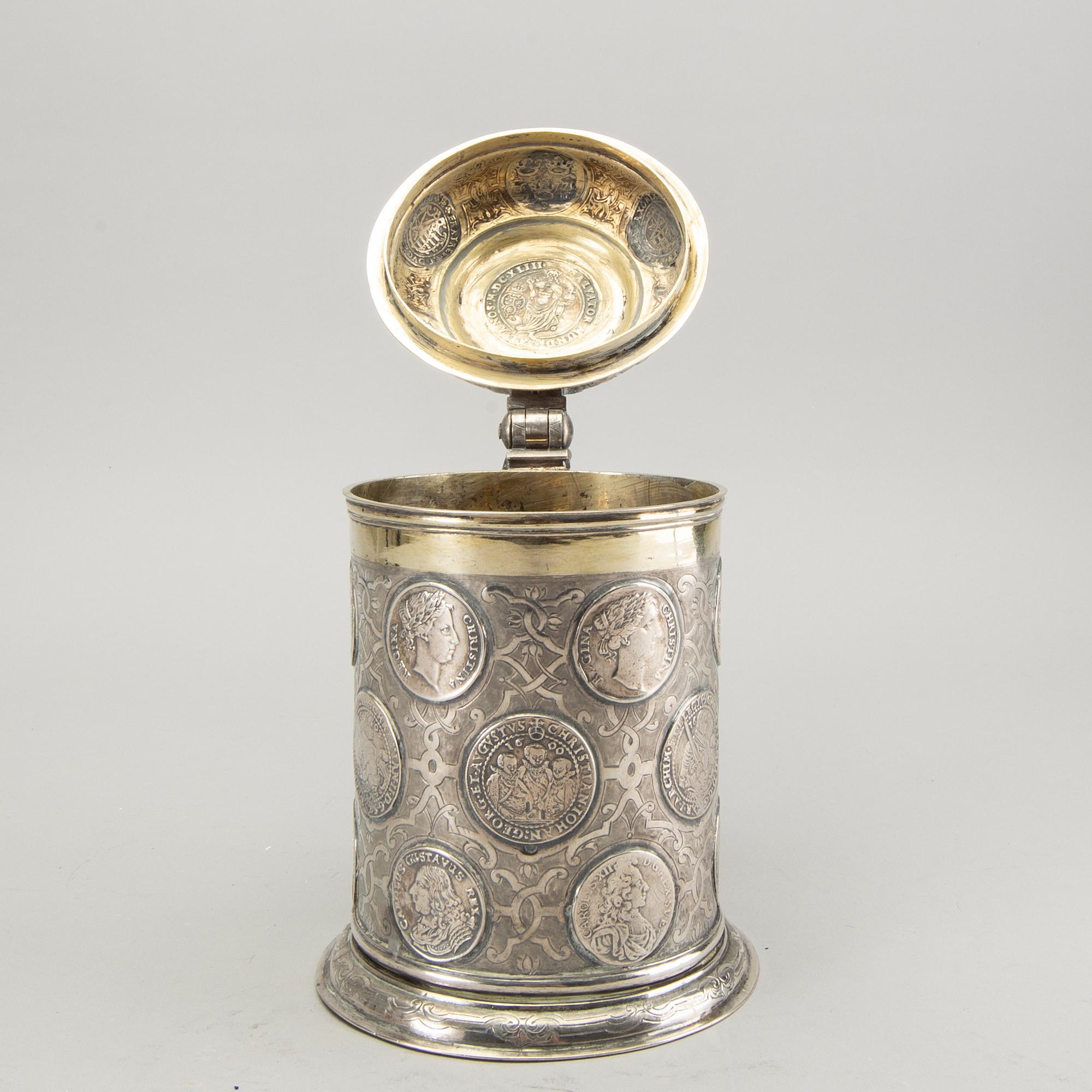 A German 18th century parcel-gilt silver coin-tankard, mark of Johann Friedrich Beyer, Schweidnitz (1736-1775).