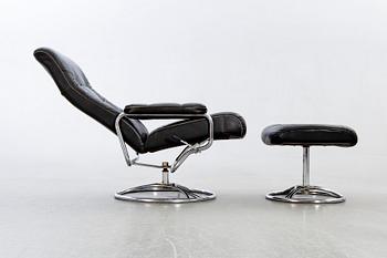 A leather swivel armchair and stool, Söderbergs  1980s.