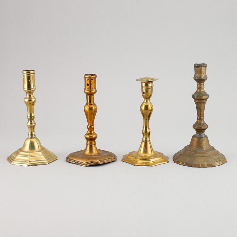 Four 18th century bronze candlesticks.