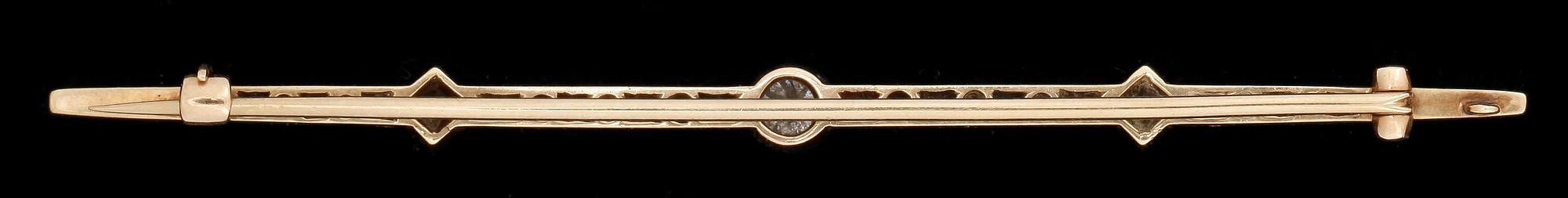 BROSCH, 14k guld samt platina med gammal- och rosenslipade diamanter, mittsten ca0,25ct. Vikt 6g.