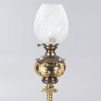 Two floor parafine lamps, 20th century.