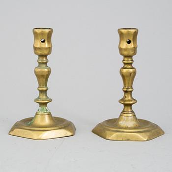 A PAIR OF BRONZE CANDLESTICKS, 18th century.