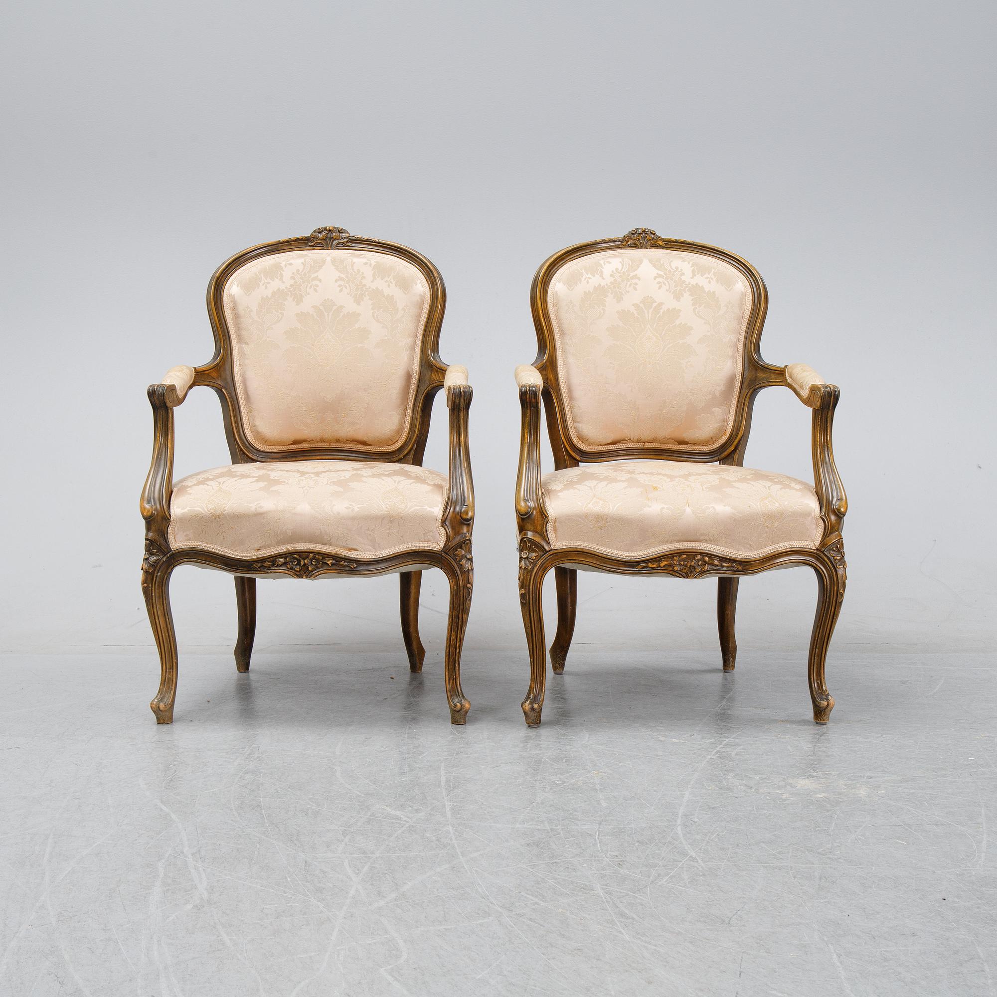 A pair of Louis XV-style arm chairs, 20th century.