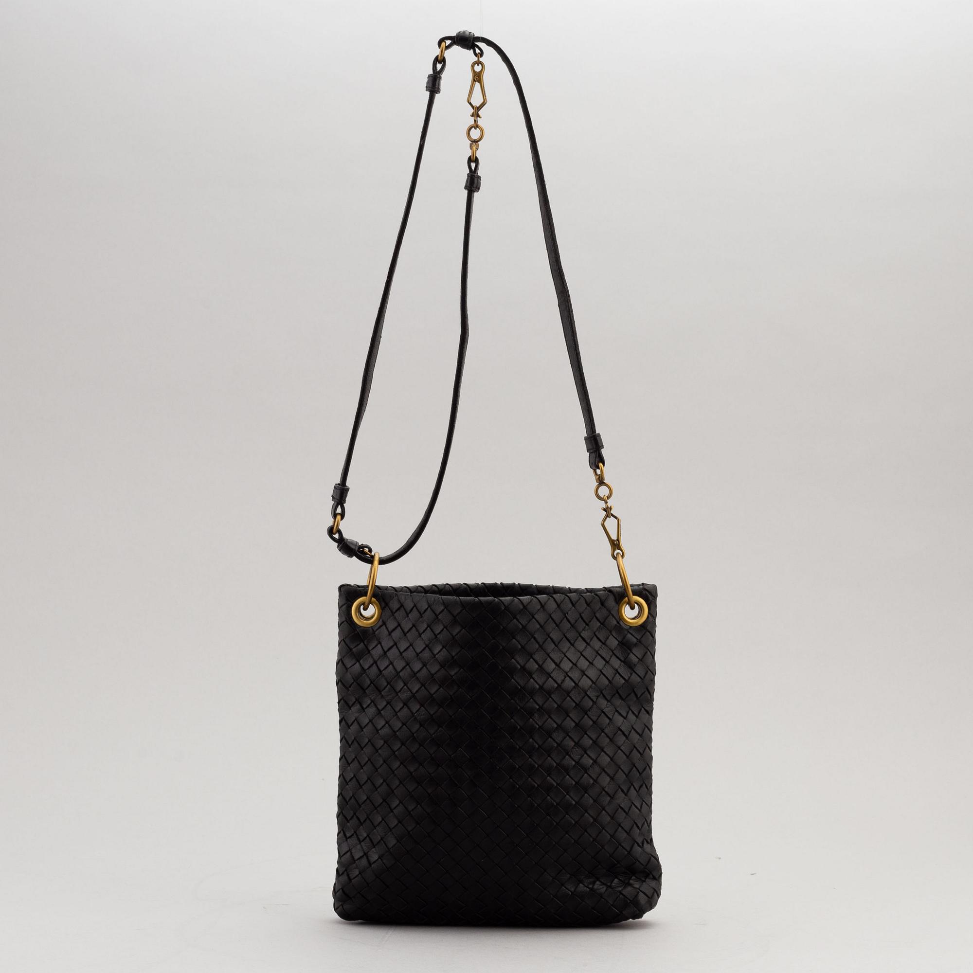 Bottega Veneta, a black intrecciato handbag.