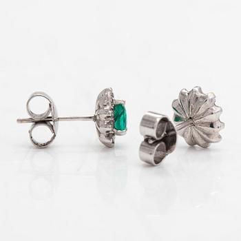 A pair of 14K white gold earrings, with emeralds and diamonds approx. 0.22 ct in total.