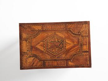 A Louis XVI parquetry miniature commode, late 18th century.