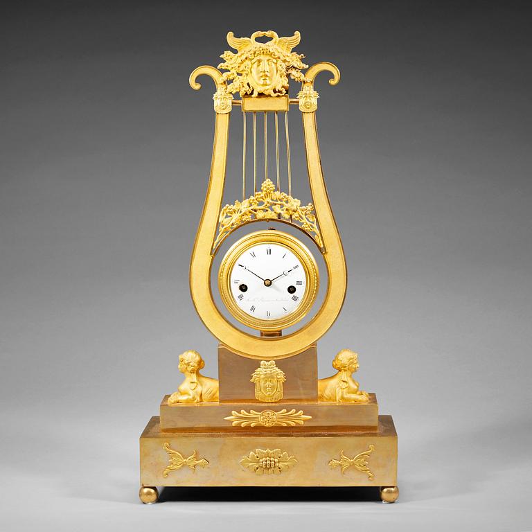 A late Gustavian early 19th century gilt bronze mantel clock.