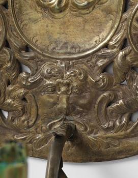 A set of four Swedish Baroque repoussé silvered brass reflector one-branch reflector plates, ca 1690-1700.