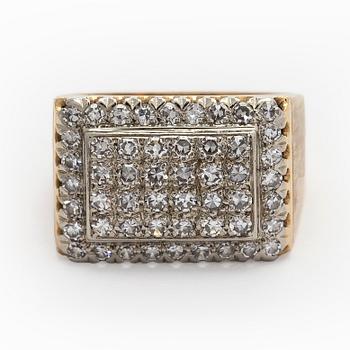 An 18K gold ring with diamonds.