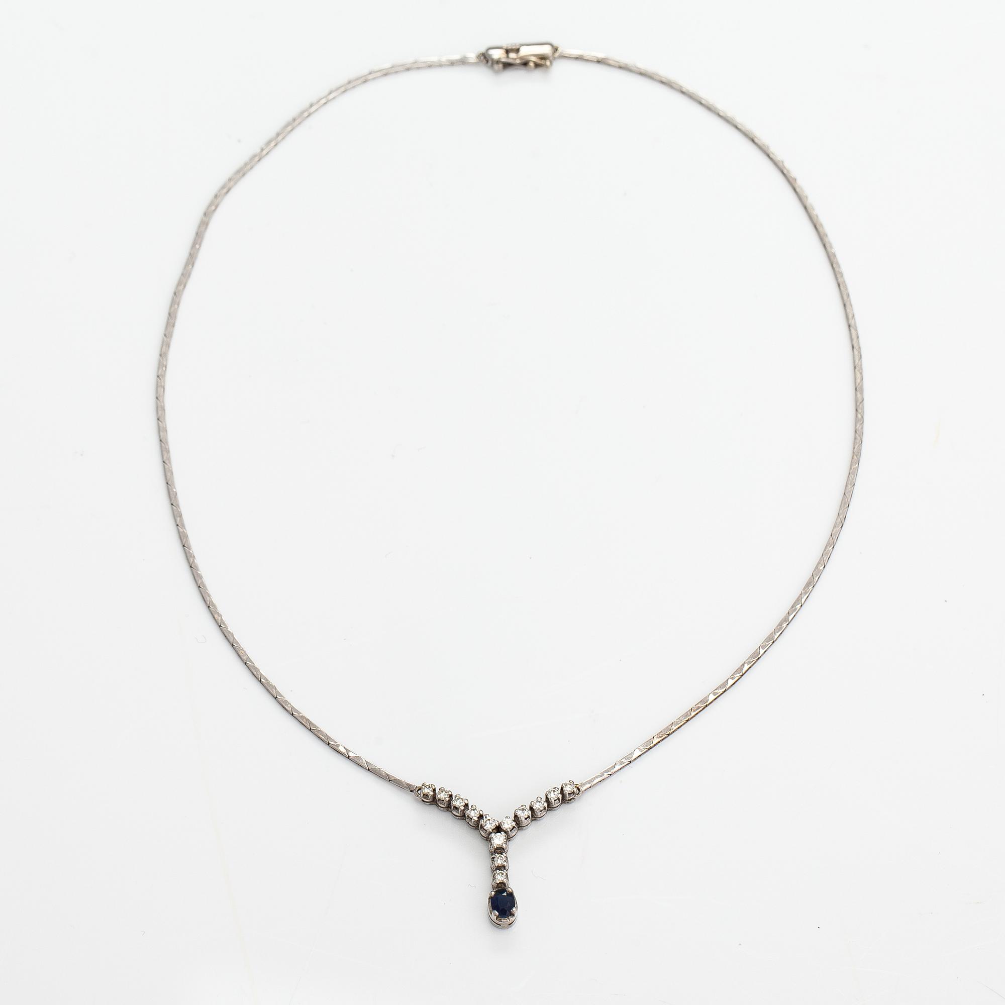 An 18K white gold necklace with a sapphire and diamonds ca. 0.41 ct in total. Finnish import marks.