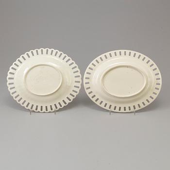 A CREAMWARE BASKET, PLATE AND A SIMILAR PLATE, one marked Wedgwood, first half of the 19th century.