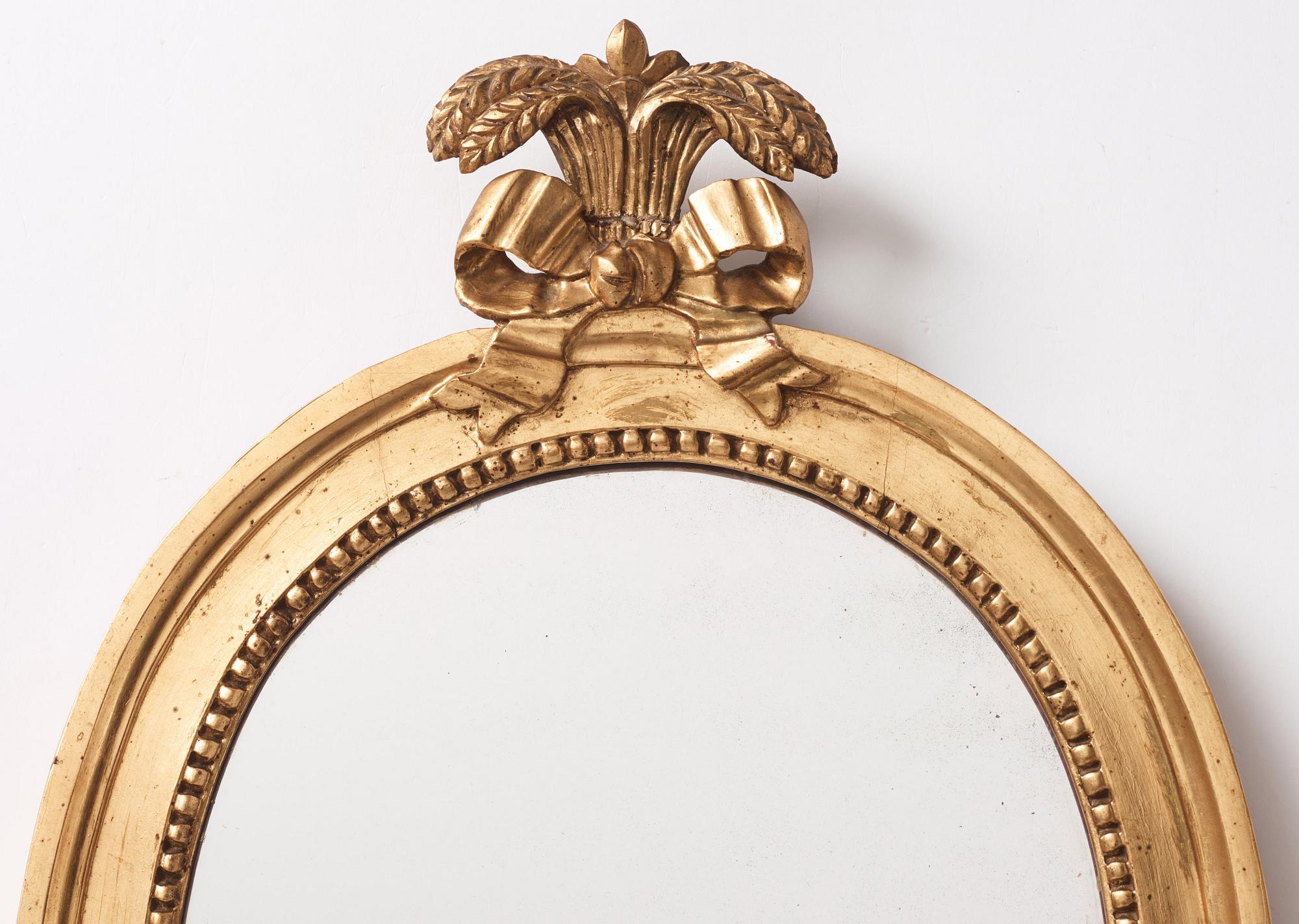 A pair of Gustavian two-light giltwood girandoles by J. Åkerblad (master 1756-1799).