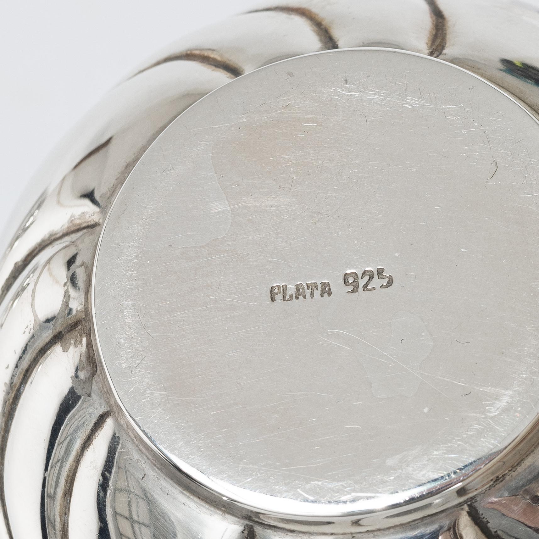 A sterling silver jug, milk jug and sugar bowl, possibly Mexico, mid20th century.