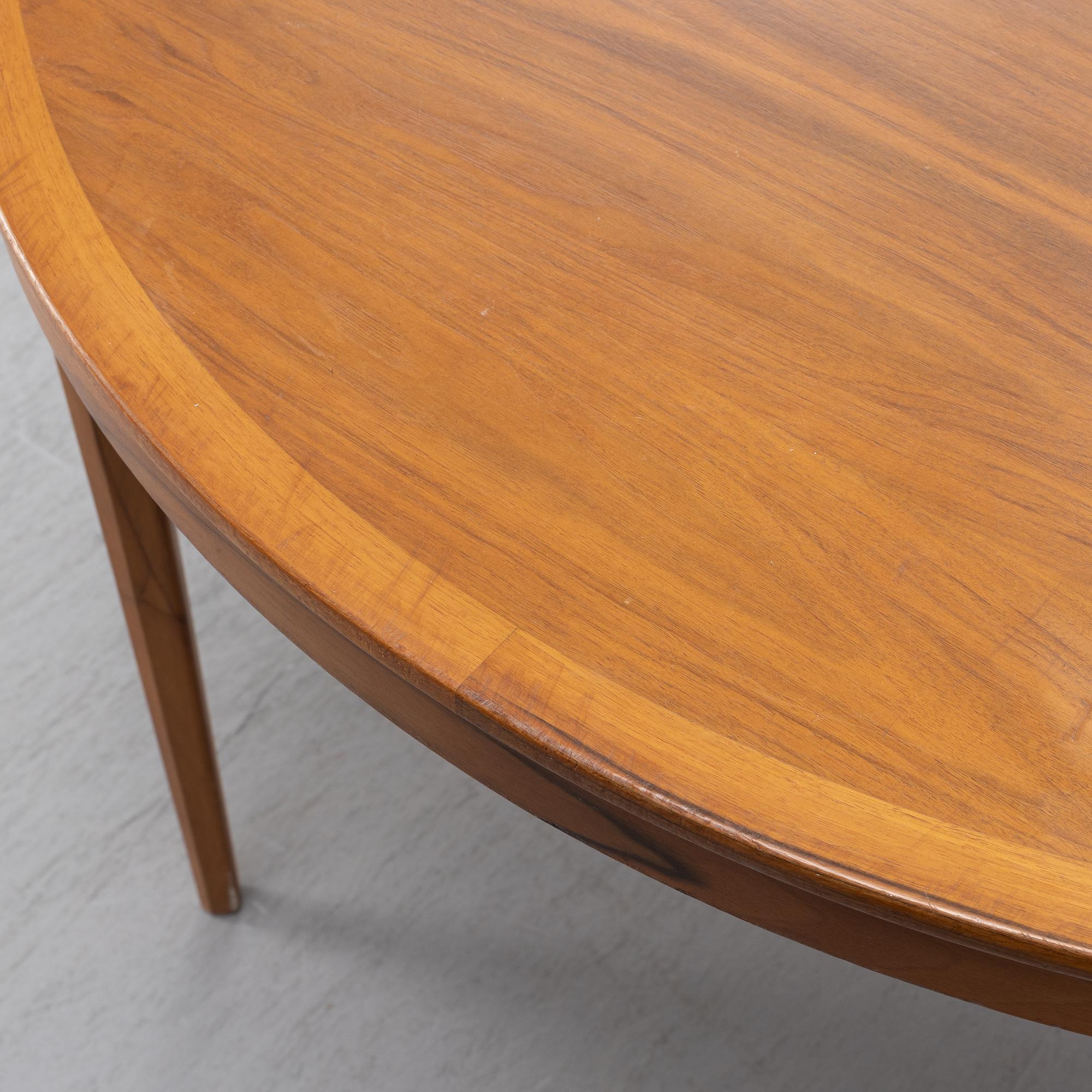 Bertil Fridhagen, a 'Diamant' walnut veneered dining table, with four additional leaves.  Bodafors.