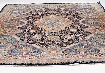 An oriental carpet, circa 390 x 302 cm.