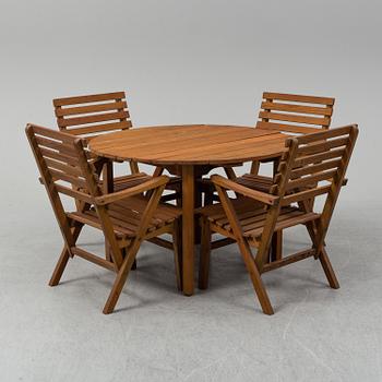 A Carl Malmsten "Bergshamra" garden table and four chairs, first half of the 20th century.