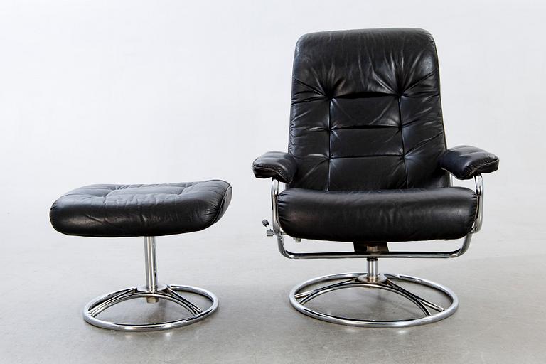 A leather swivel armchair and stool, Söderbergs  1980s.