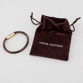 A bracelet by Louis Vuitton.