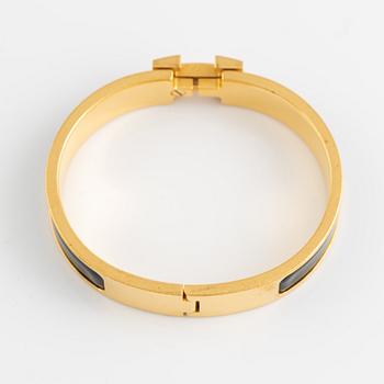 Hermès, a 'Clic H' bracelet.