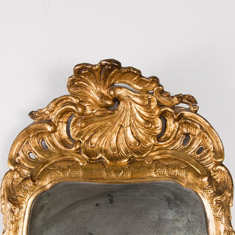 A SWEDISH ROCOCO MIRROR, late 18th century.